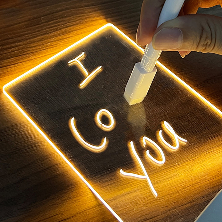Glowing acrylic message board lamp on wooden base